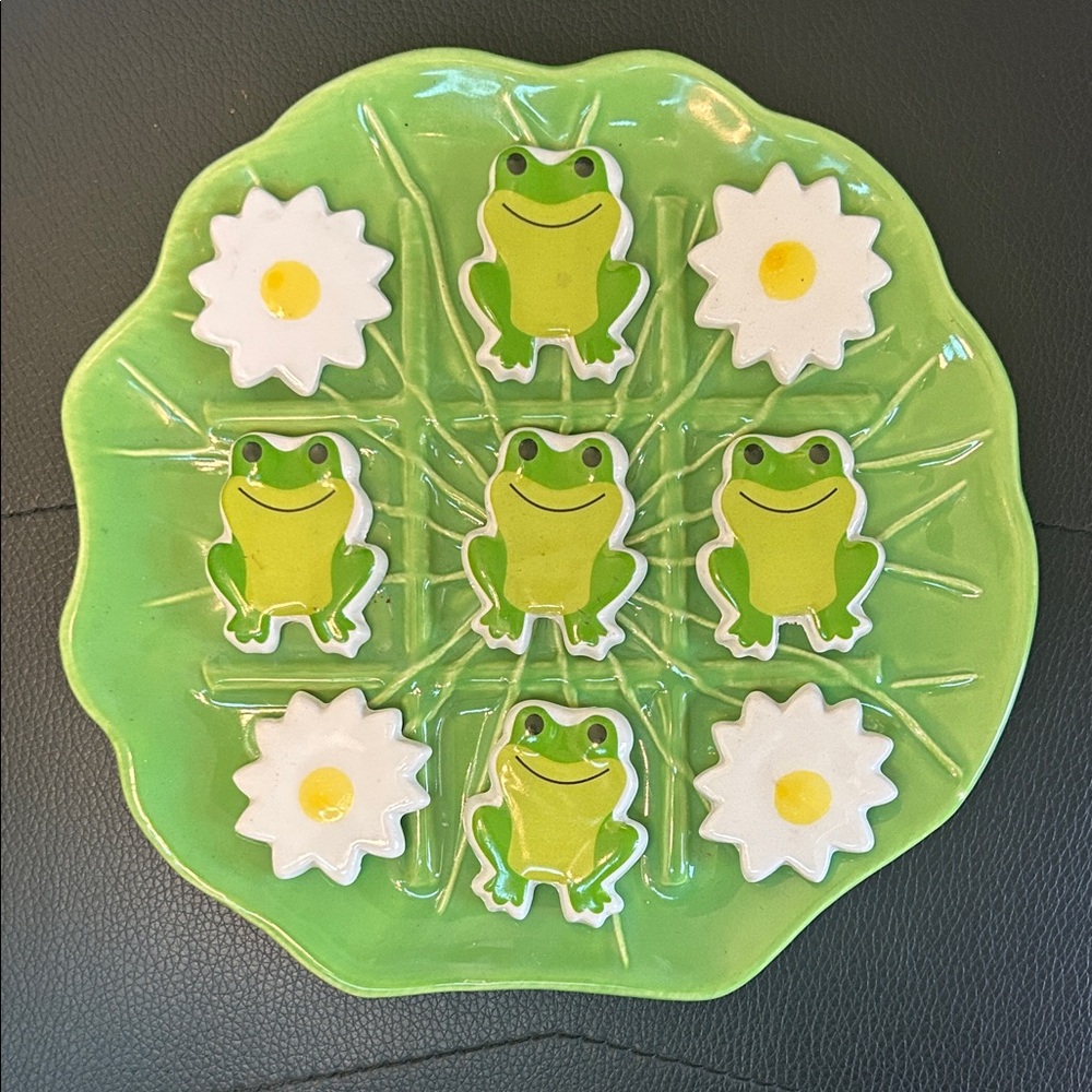 ceramic tic-tac-toe game set with a frog and lily pad theme.